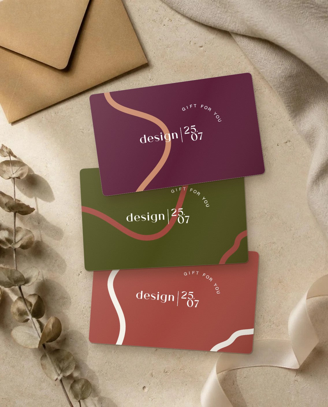 design 25.07 printed gift cards in burgundy, olive and terracotta